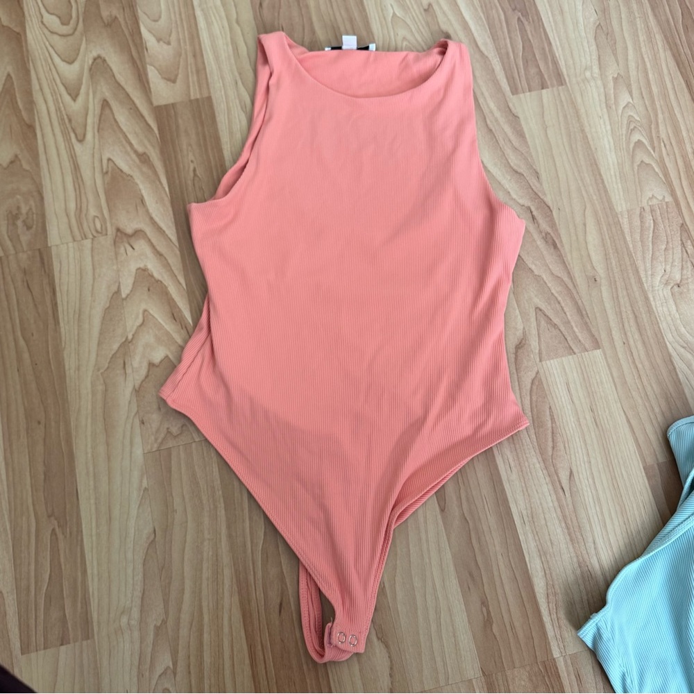 Peach Ribbed High Neck Bodysuit